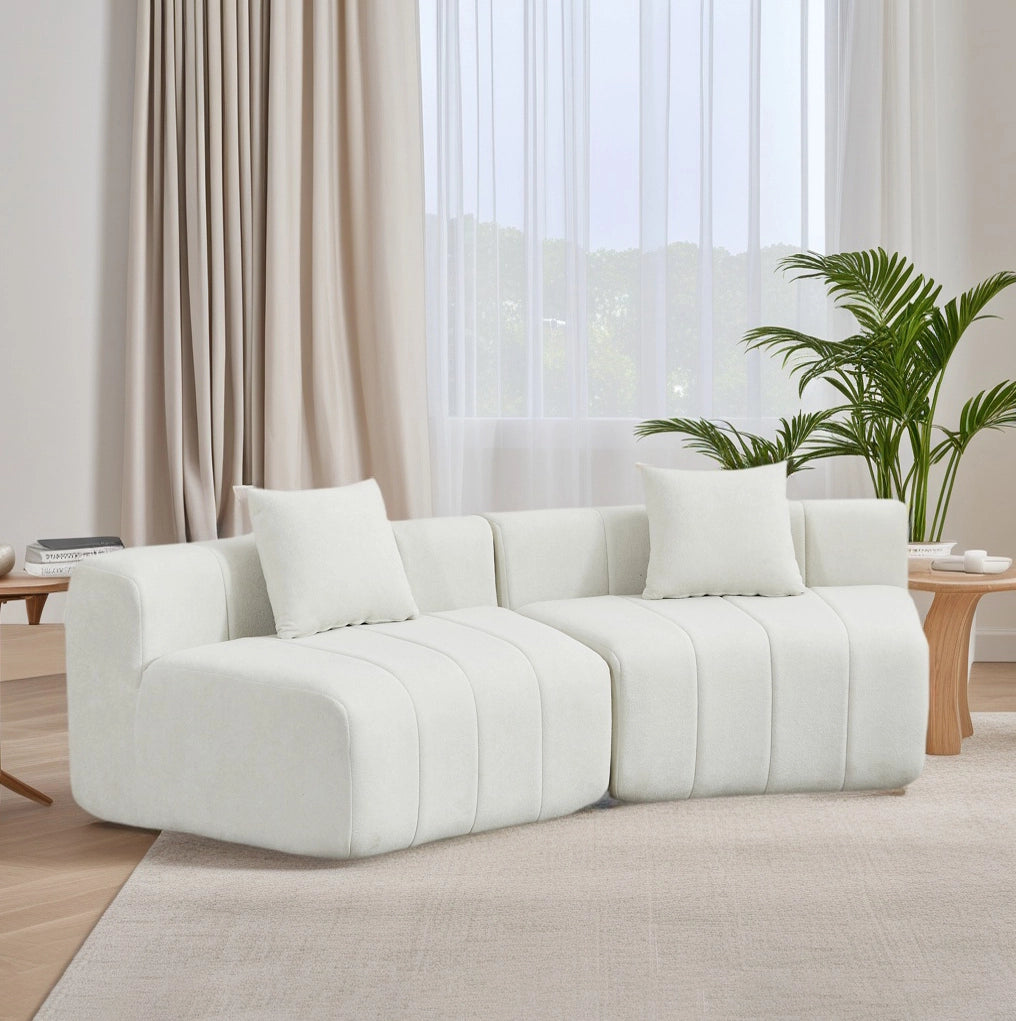 Modulo divano curvo in ciniglia beige con 2 cuscini