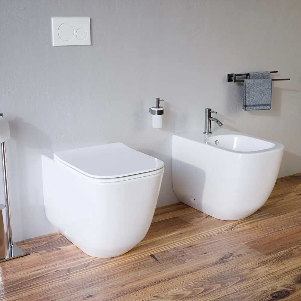 Sanitari filomuro in ceramica bianco lucido vaso tornado silent flush sedile soft-close e bidet | Riga