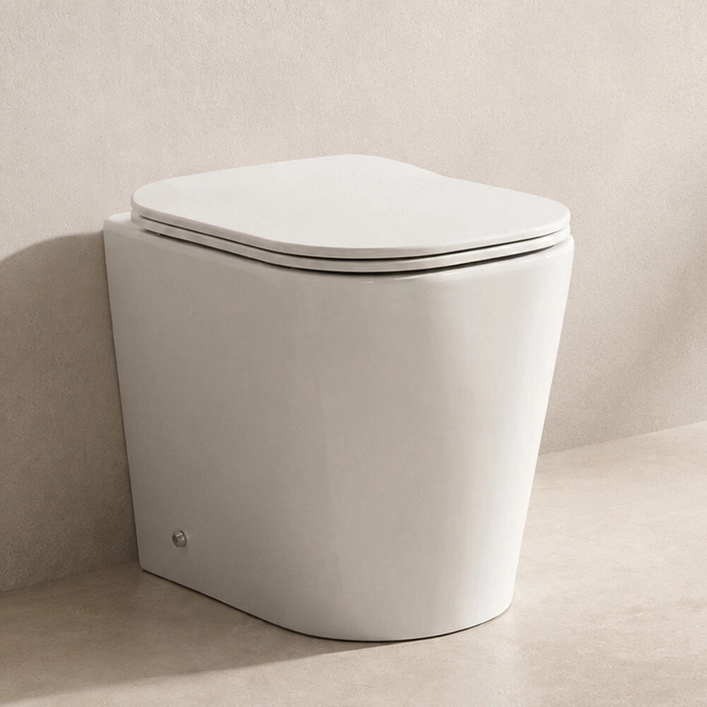 Wc filo muro profondità 48cm con scarico universale tornado e sedile soft close Atami