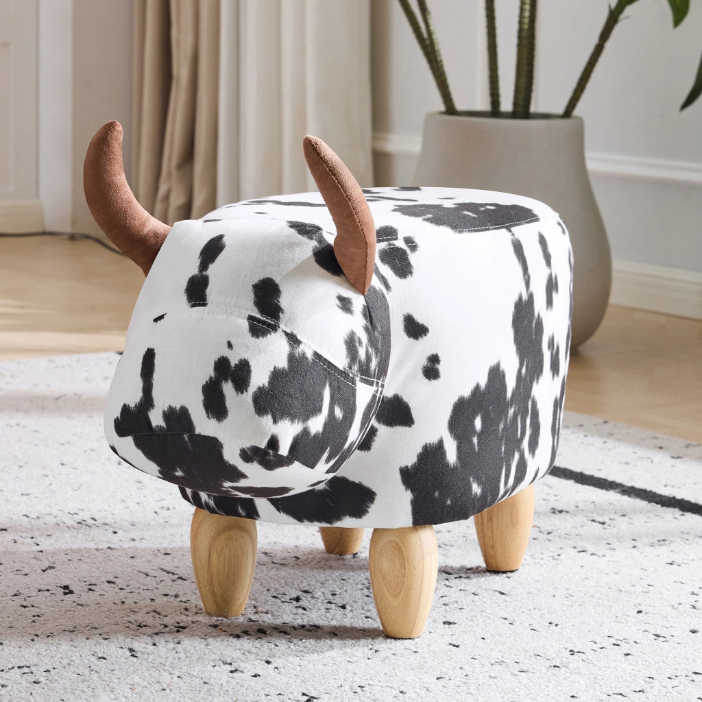 Sgabello a forma di mucca 62x35x36 cm; poggiapiedi e seduta per bambini; gambe in legno; nero e bianco